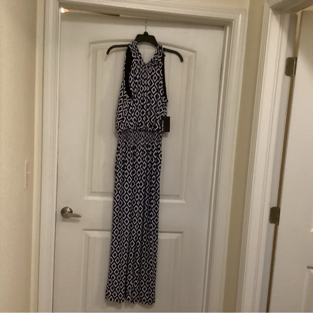 Navy, black and White Geometric Jumpsuit
NWT. Smoke/ pet free home.